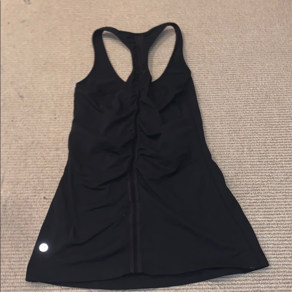 Black tank top with ruffle detail in the back
